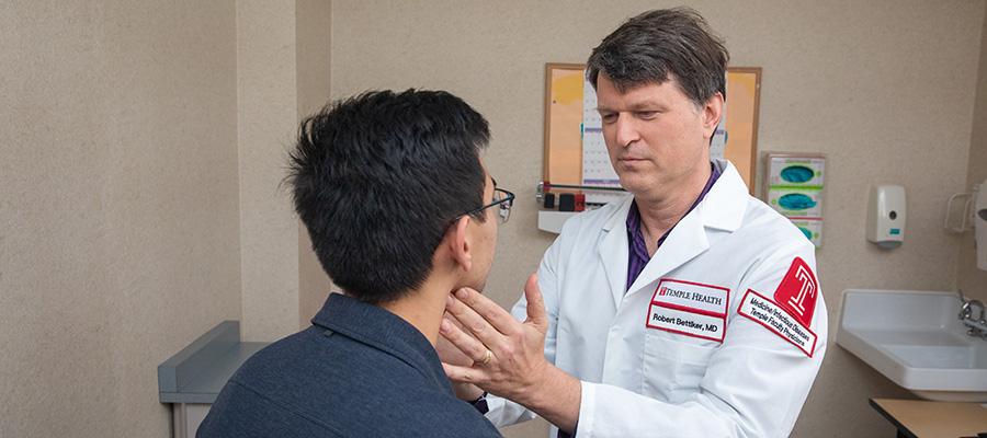 Infectious disease specialist Robert Bettiker with patient