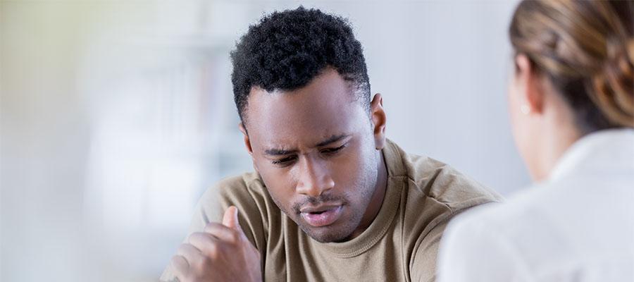 Distraught patient talks with doctor