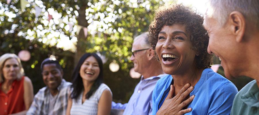 Diverse group of friends socializing in the backyard