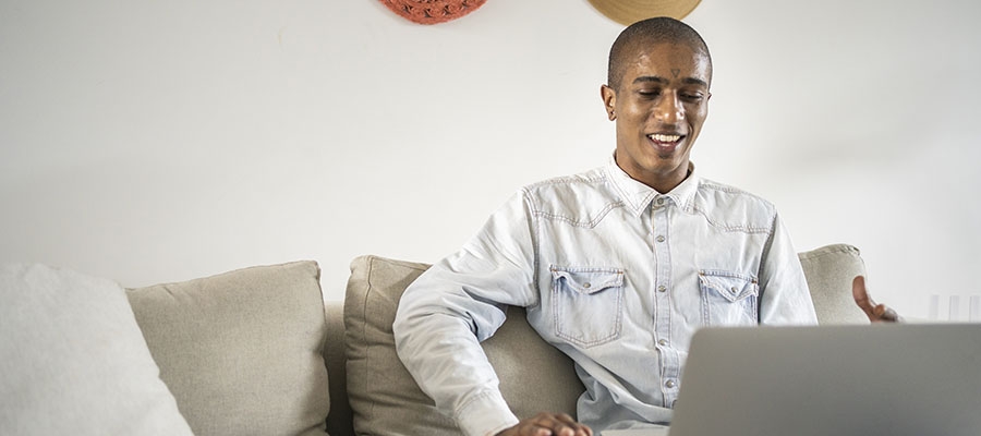 Patient researching insurance on laptop
