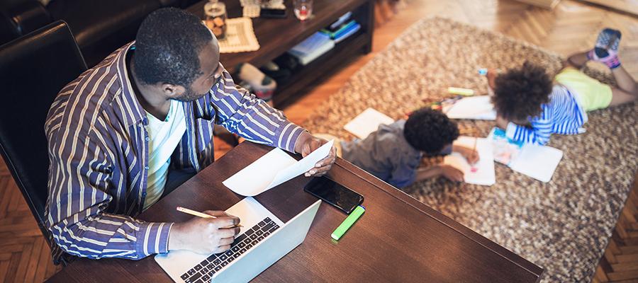 Father working from home on his laptop