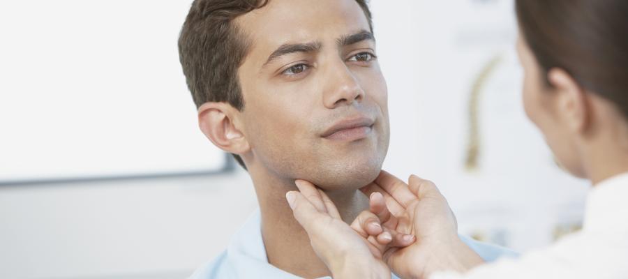 Physician looking at patients throat