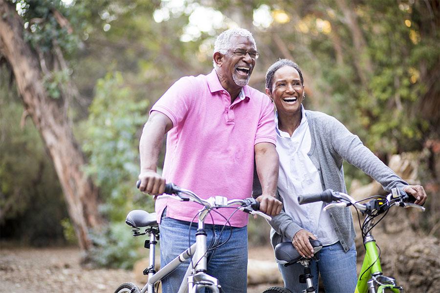 Senior African American couple riding their bikes