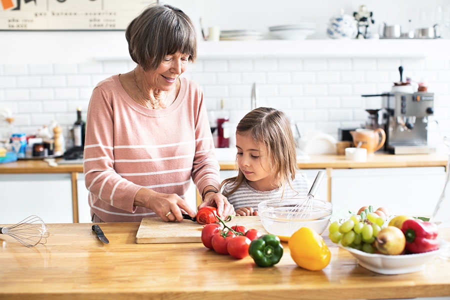Grandmom and grandkid making healthy food