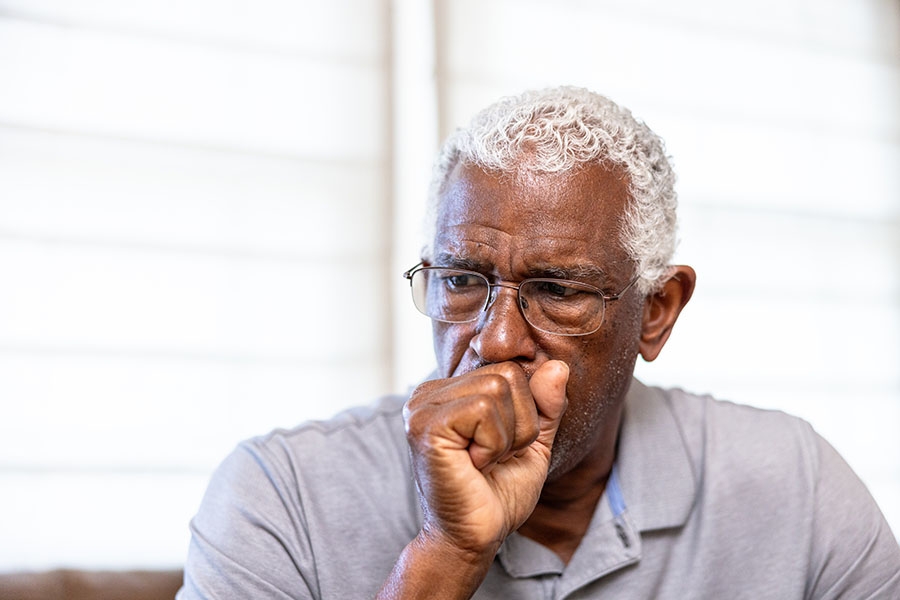 Man coughing into his hand