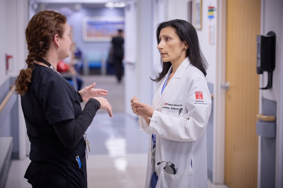 doctor and staff speaking