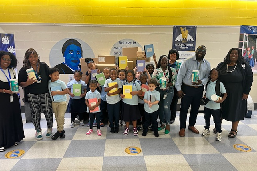 Students at Bethune Elementary School with some of the donations from our TUH-Main Campus School Supply Drive.