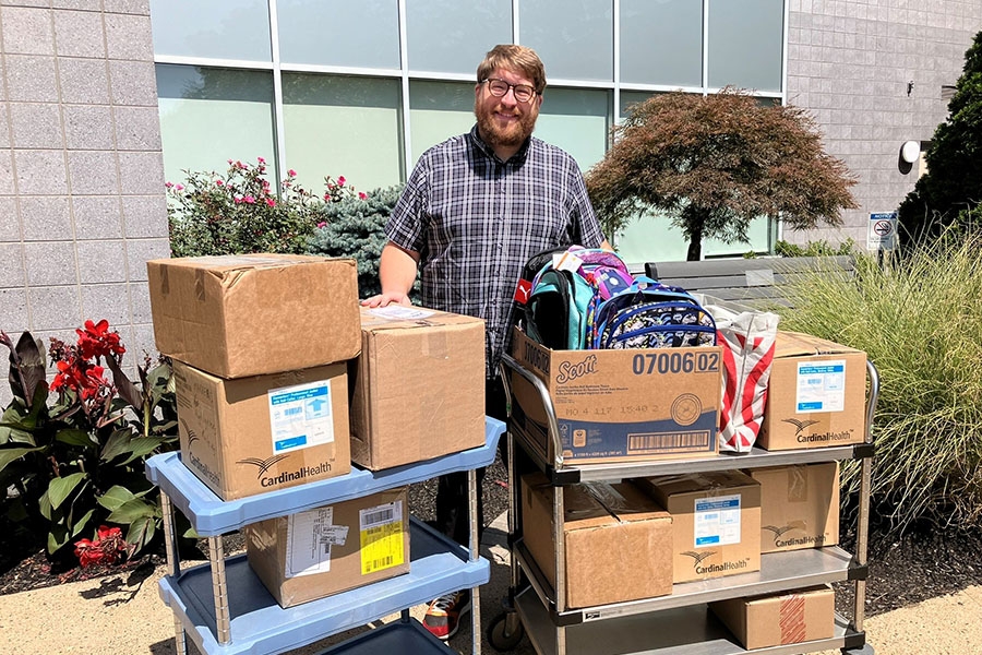 Pastor Timothy Wotring, from Memorial Presbyterian Church of Fox Chase, picking up donations of school supplies for Food for Hope food pantry.
