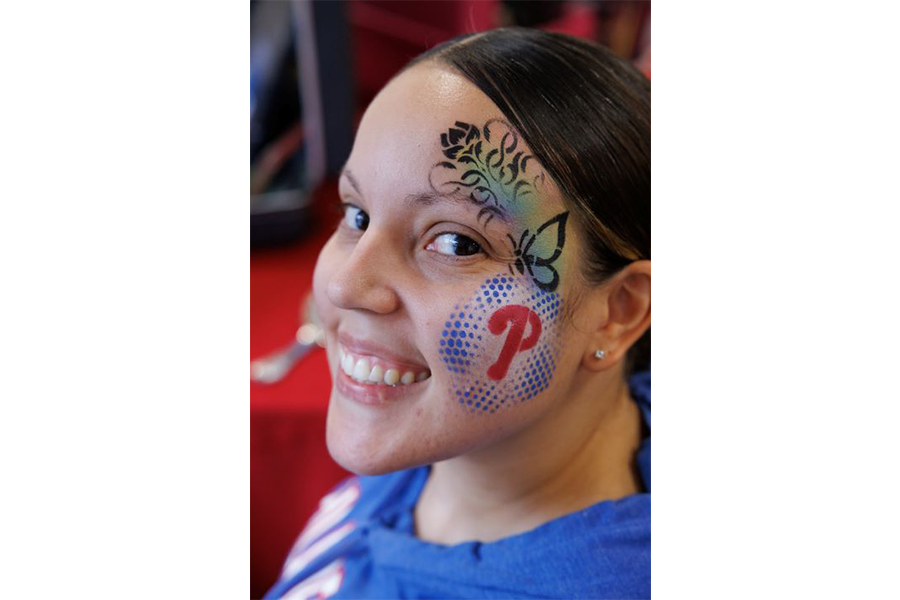 A Jeanes employee demonstrates her Phillies pride with some face paint.