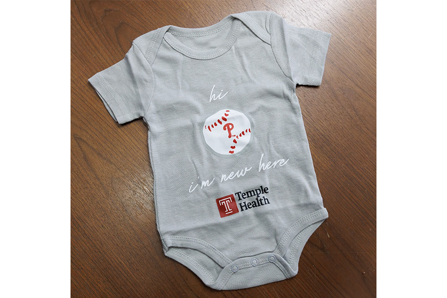 The exclusive Temple- and Phillies-branded onesies.