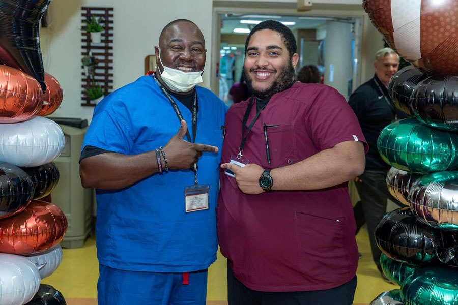 Two employees—and friends—at TH-CHH.