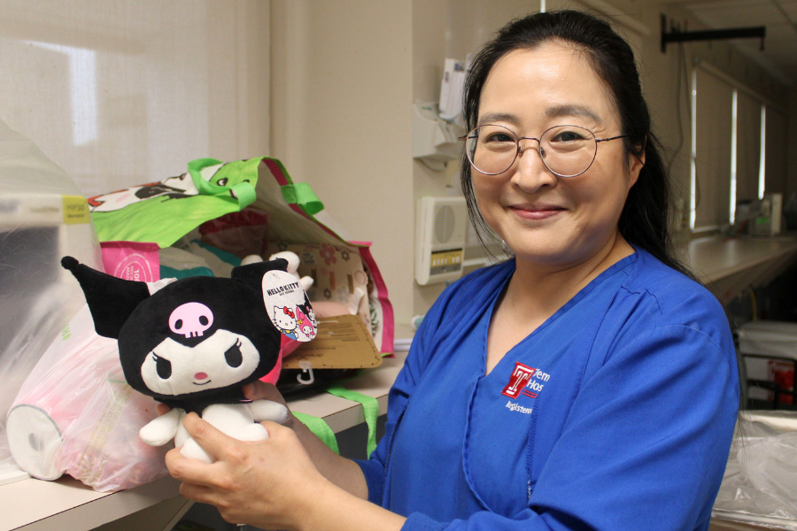 Baek with a stuffed animal she'll put on top of one of her diaper cakes.