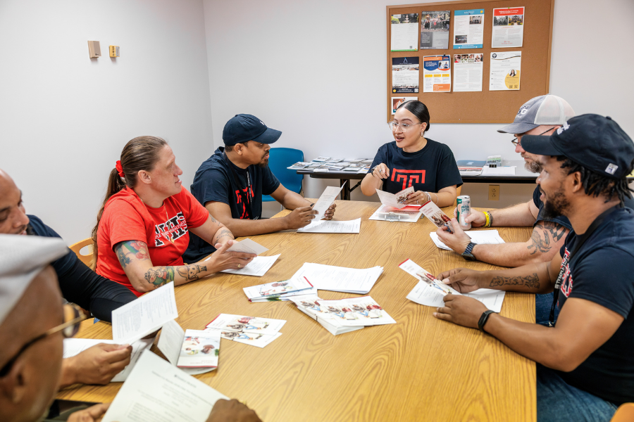 Gonzalez with the Certified Recovery Specialists at a team meeting at the Substance Use Disorder Clinic.