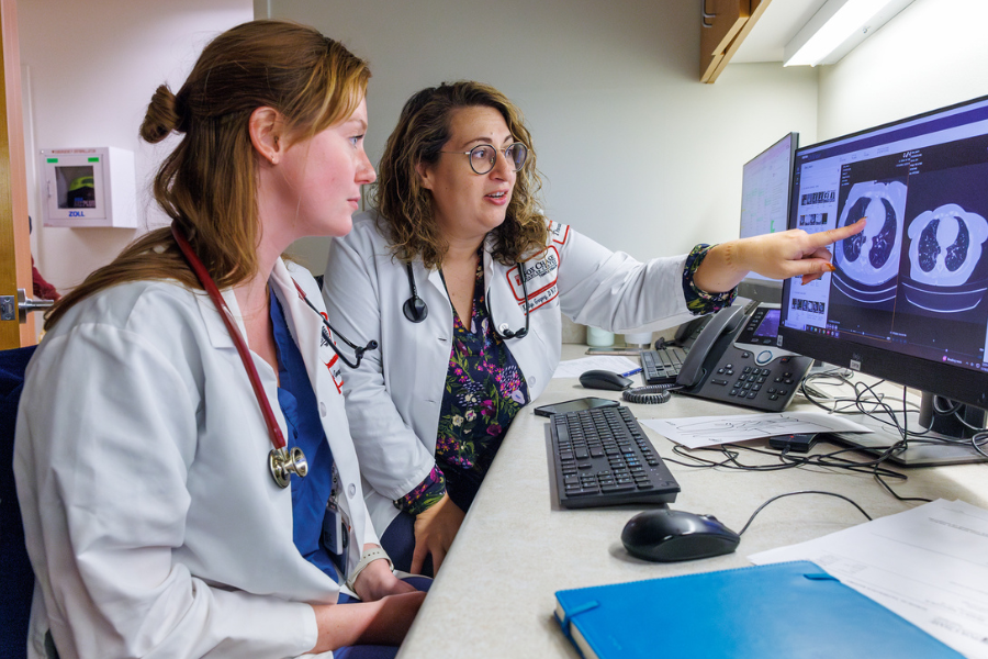 Gregory reviews imaging with a colleague.