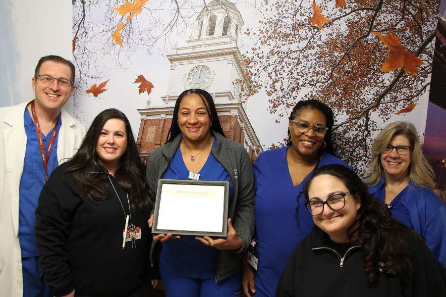 Tiffany celebrates her achievement with some of her colleagues.