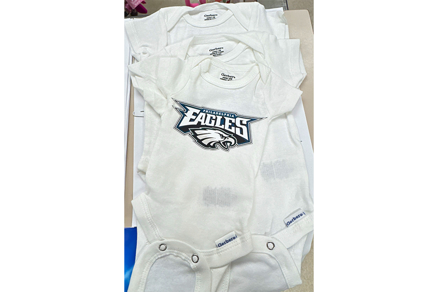 A close-up of the Eagles onesies.