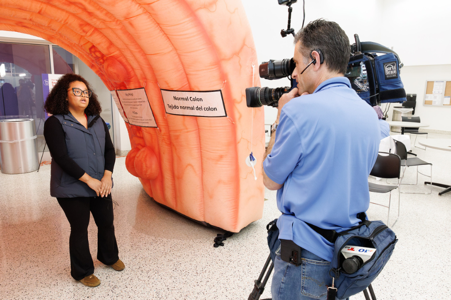 Dalia Mejia, a bilingual health educator at Fox Chase, is interviewed by NBC10 at the TUH-Main Campus event.