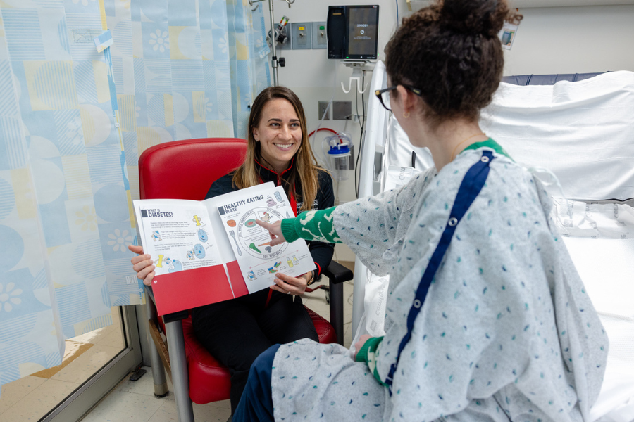 Casey Dascher talks a patient through a healthy eating plan.