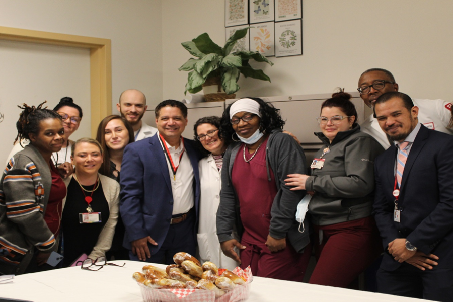 Rich Hernandez (center left) and his coworkers in Otolaryngology celebrate his TFP C.A.R.E.S Award.
