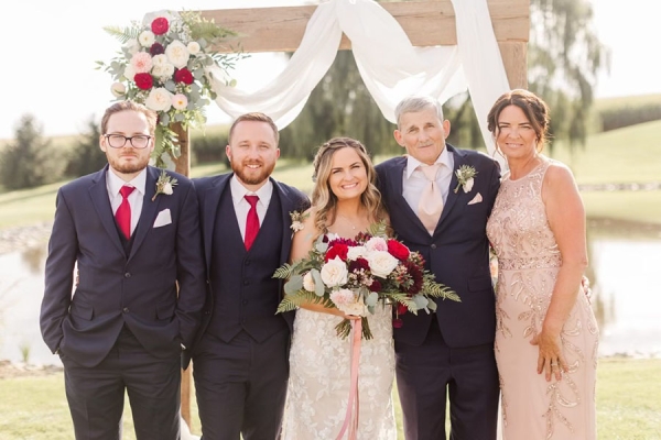John with his family at wedding