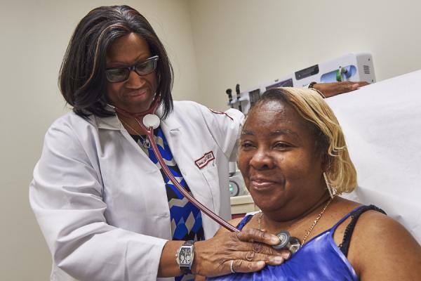 Dr. Crabbe checking patients heart