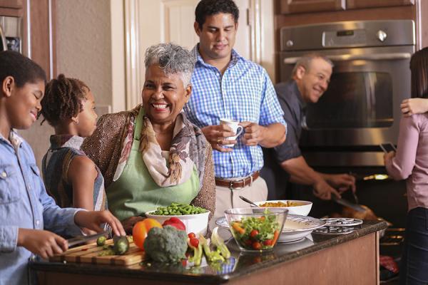 Family cooking together in kitchen for holidays
