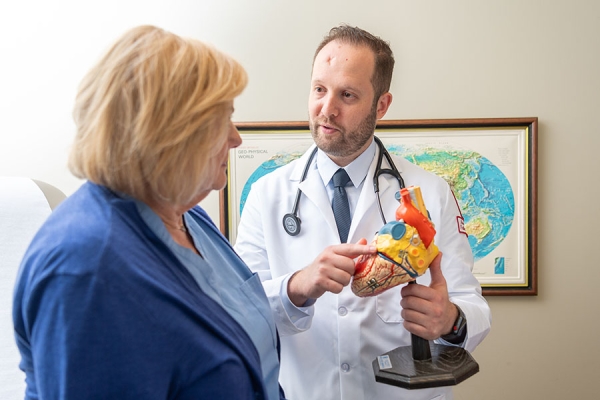 Dr. Rakita explaining heart to patient