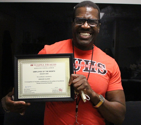 Gregory Slater holding award