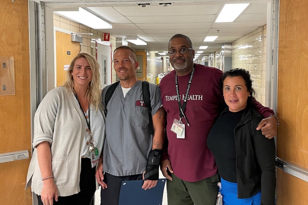 Gavetti (center left) with his supervisor, Paul Ray, Michelle Maag, and a nurse from the unit.