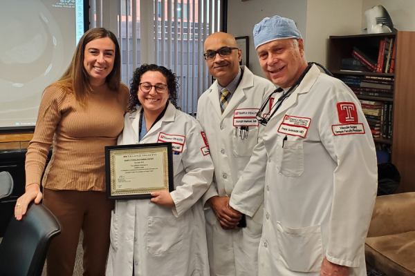 Dr. Lubitz (second from left) accepts her Physician Kudos award from Claire Raab, MD, President & CEO of Temple Faculty Physicians (far left); Dr. Pathak (second from right); and Frank Schmieder, MD, FACS, Chief of Vascular Surgery at TUH-Jeanes Campus, Surgical Director of the Temple Heart & Vascular Institute, and Professor of Clinical Surgery at the Lewis Katz School of Medicine (far right).