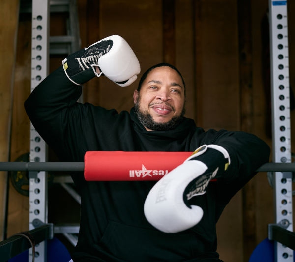 Donald with boxing gloves on at the gym