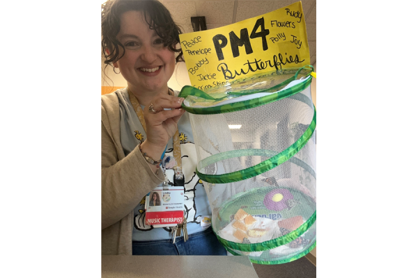 Episcopal Campus Behavioral Health Therapist Lindsy Burns holding some of the butterflies pre-release.