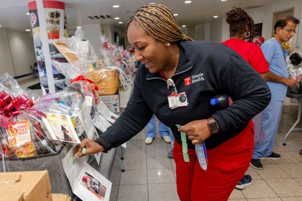 An employee chooses a basket during the raffle.