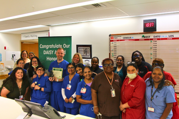 Brandon and his colleagues celebrate his DAISY Award.