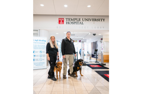 Crisis Response Canines Lincoln and Axel with their handlers.