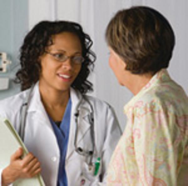 Radiation oncologist talking with patient