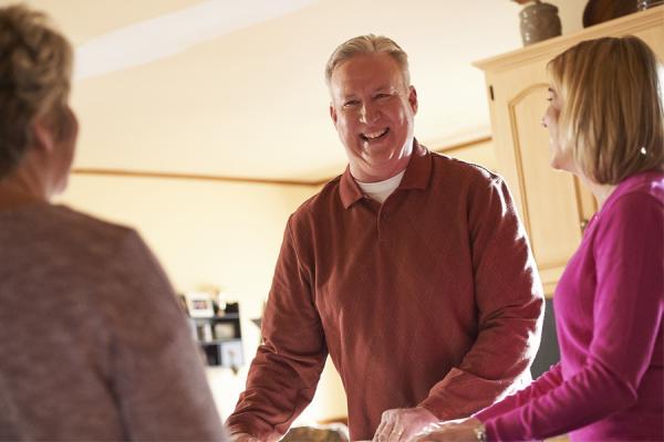 Lung patient Michael laughing with his family 