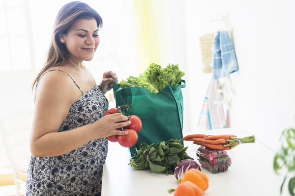 Bariatric patient unpacking healthy groceries