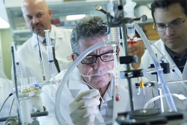 Dr. Steven Houser conducting research in lab