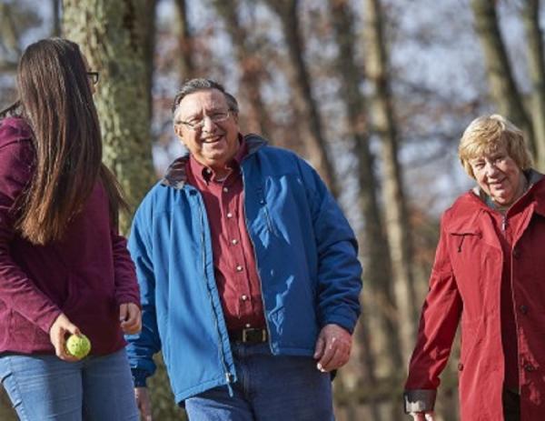 Temple heart transplant patient, Gerry, outside with his wife and granddaughter