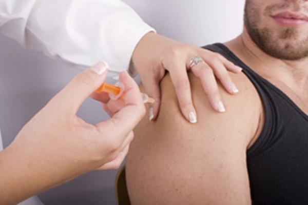 Doctor giving patient a shot