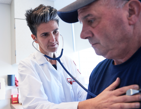 Lung doctor checking patient with a stethoscope